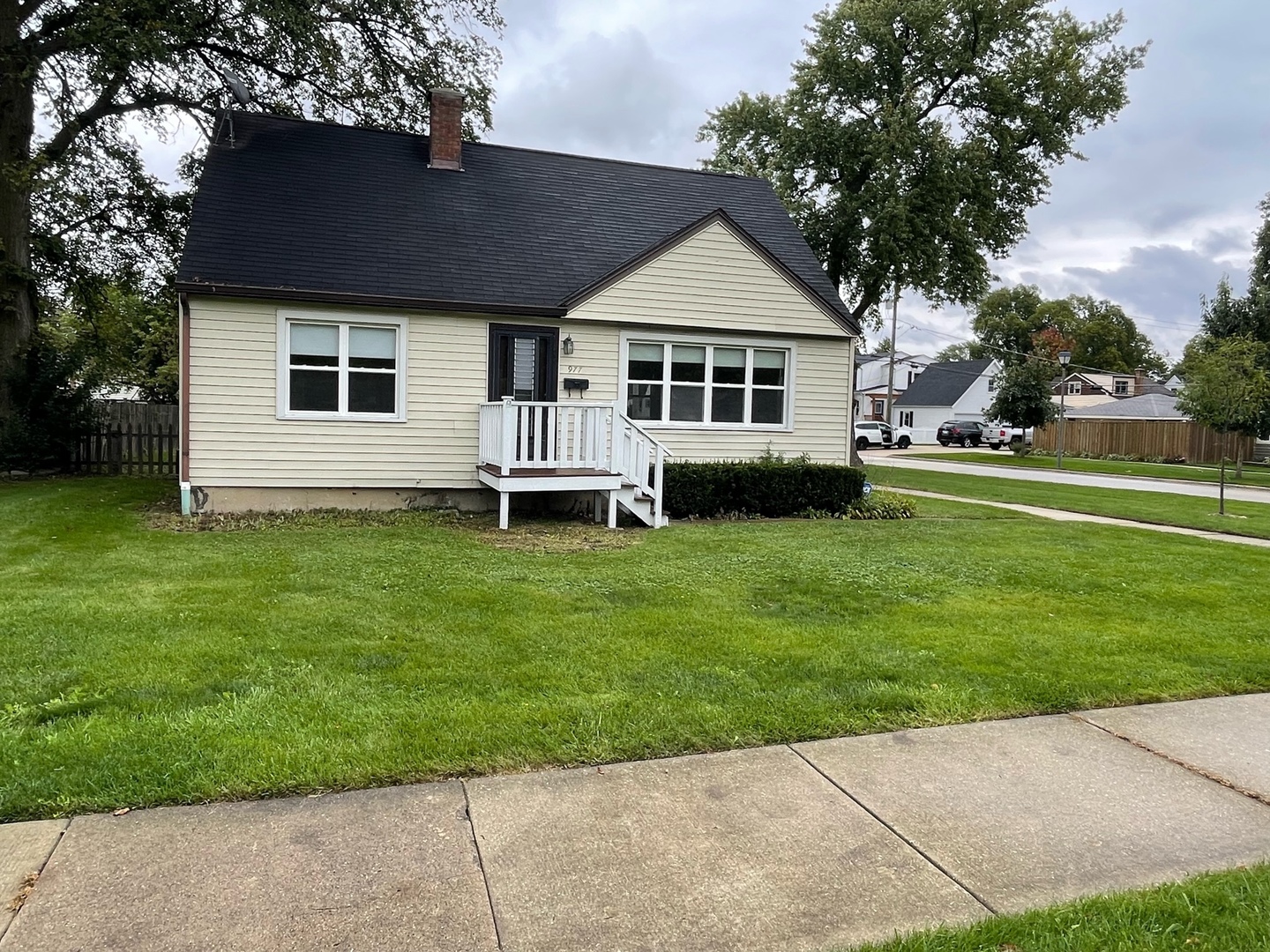 977 Spring Road Elmhurst, IL 60126 - Photo 13 of 13 a front view of a house with a garden