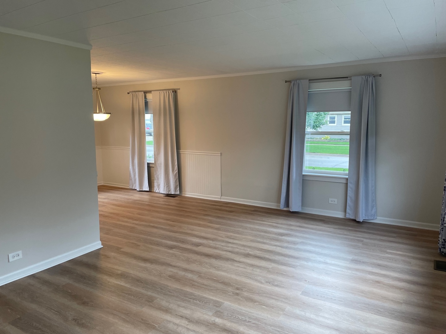 977 Spring Road Elmhurst, IL 60126 - Photo 2 of 13 wooden floor in an empty room with a window