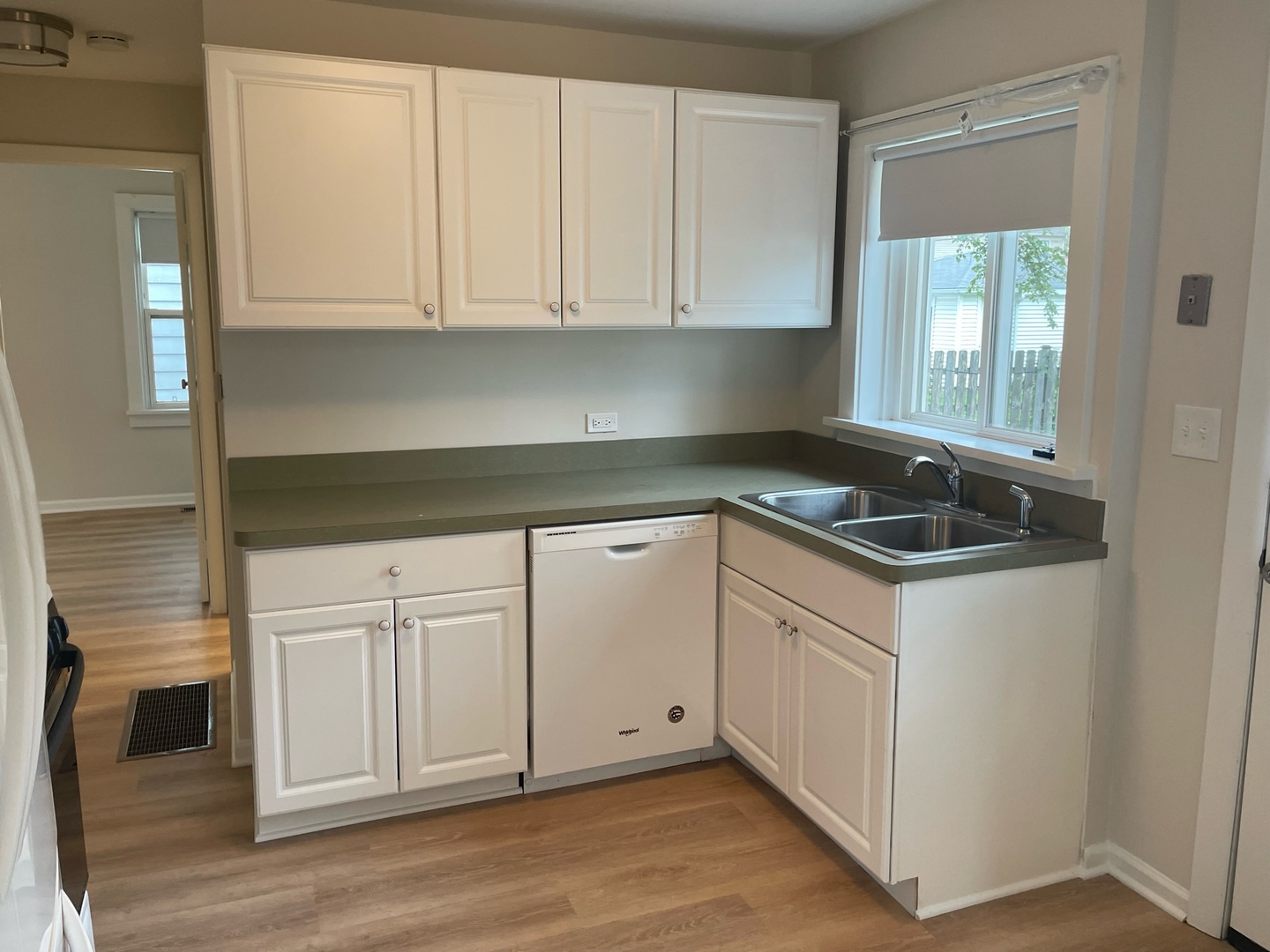977 Spring Road Elmhurst, IL 60126 - Photo 5 of 13 a view of a kitchen with white cabinets