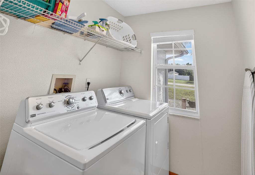 4995 Brook Road Kissimmee, FL 34758 - Photo 26 of 46 a utility room with dryer and washer