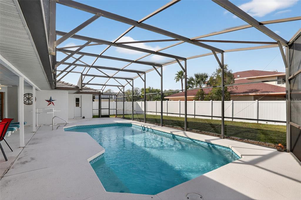 4995 Brook Road Kissimmee, FL 34758 - Photo 29 of 46 a swimming pool with a yard