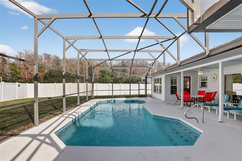 4995 Brook Road Kissimmee, FL 34758 - Photo 30 of 46 a view of a backyard with sitting area