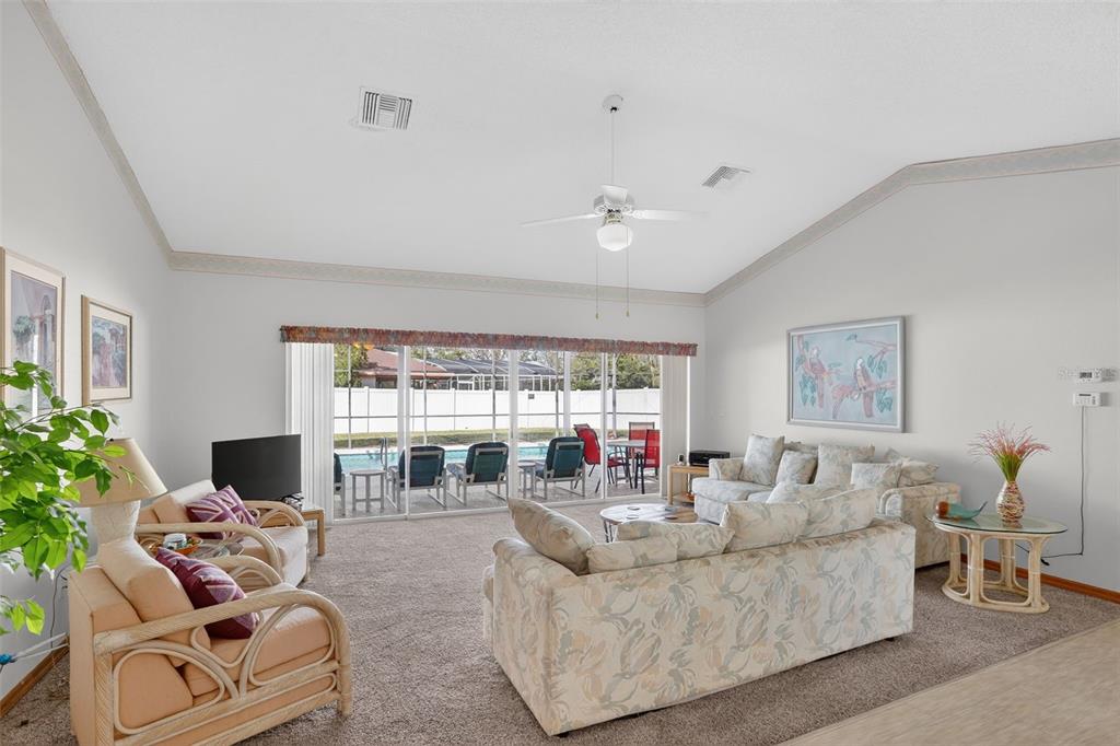 4995 Brook Road Kissimmee, FL 34758 - Photo 3 of 46 a living room with furniture and a large window
