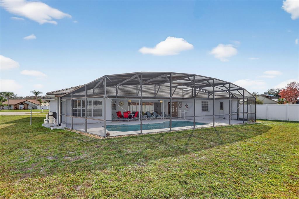 4995 Brook Road Kissimmee, FL 34758 - Photo 34 of 46 a view of a house with a yard and a garden