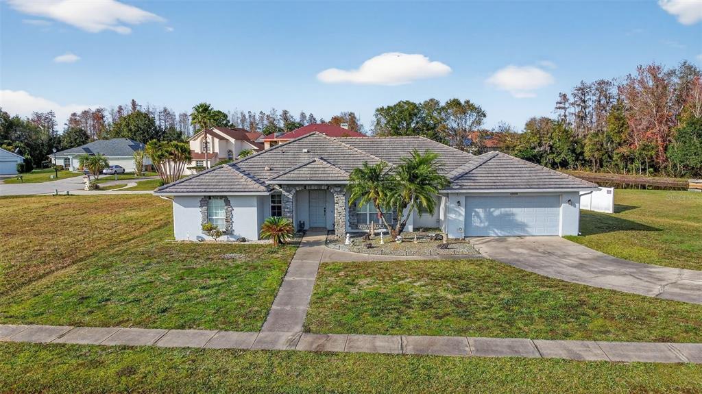 4995 Brook Road Kissimmee, FL 34758 - Photo 35 of 46 a front view of a house with garden