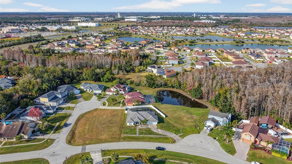 4995 Brook Road Kissimmee, FL 34758 - Photo 37 of 46 an aerial view of residential houses with outdoor space and swimming pool
