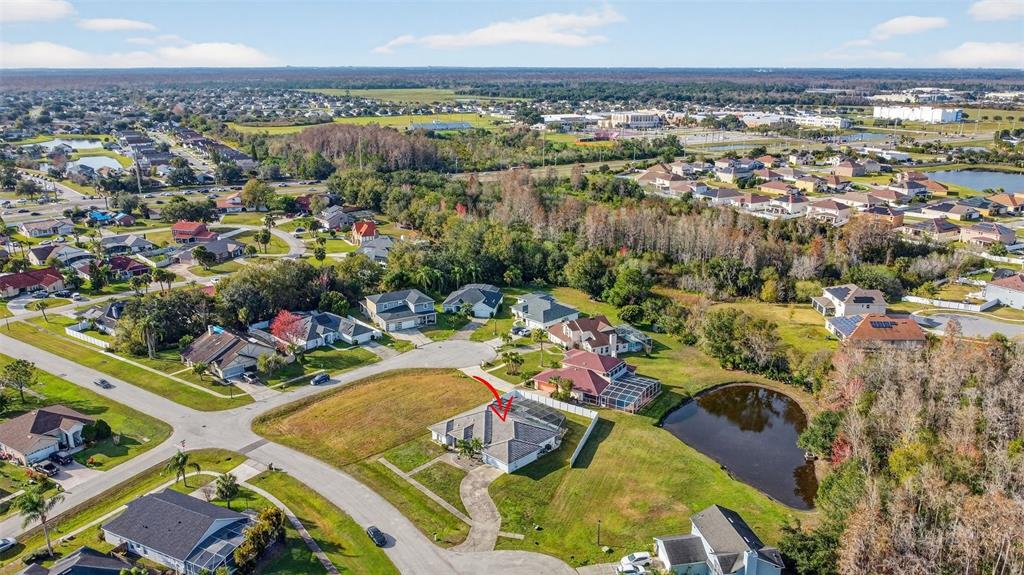 4995 Brook Road Kissimmee, FL 34758 - Photo 38 of 46 an aerial view of a swimming pool a playground and lake view
