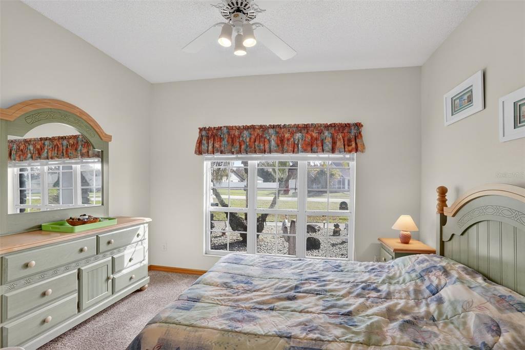 4995 Brook Road Kissimmee, FL 34758 - Photo 7 of 46 a bedroom with a bed and a dresser