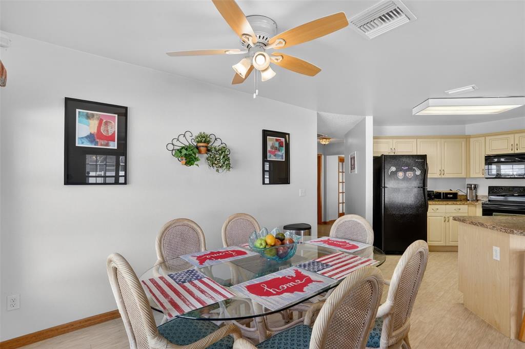 4995 Brook Road Kissimmee, FL 34758 - Photo 9 of 46 a view of a dining room with furniture