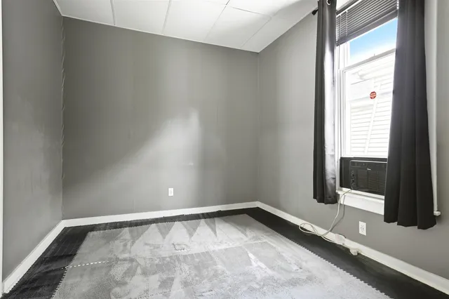 a view of an empty room and a window