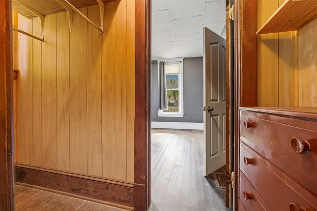 a kitchen with a refrigerator and a stove top oven