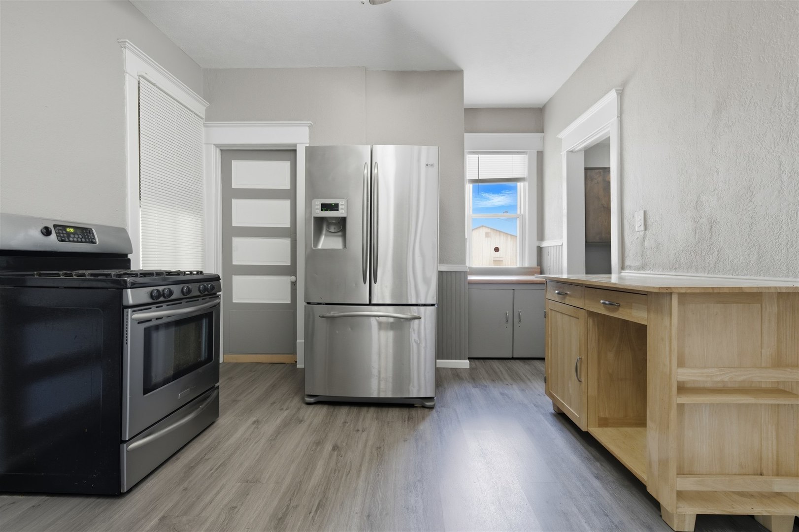 603 West Oakland Avenue Bloomington, IL 61701 - Photo 18 of 33 a kitchen with a refrigerator and a stove top oven