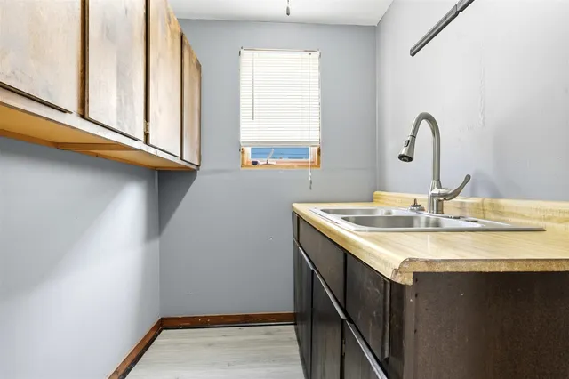 a bathroom with a granite countertop bathtub shower sink and toilet