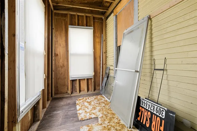 an empty room with a mirror