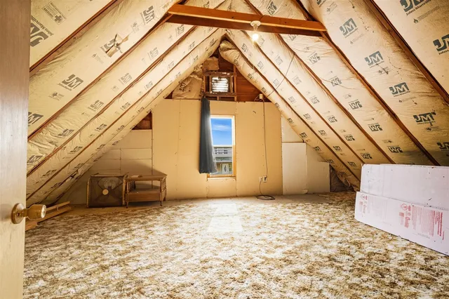 a view of a chairs and table in backyard