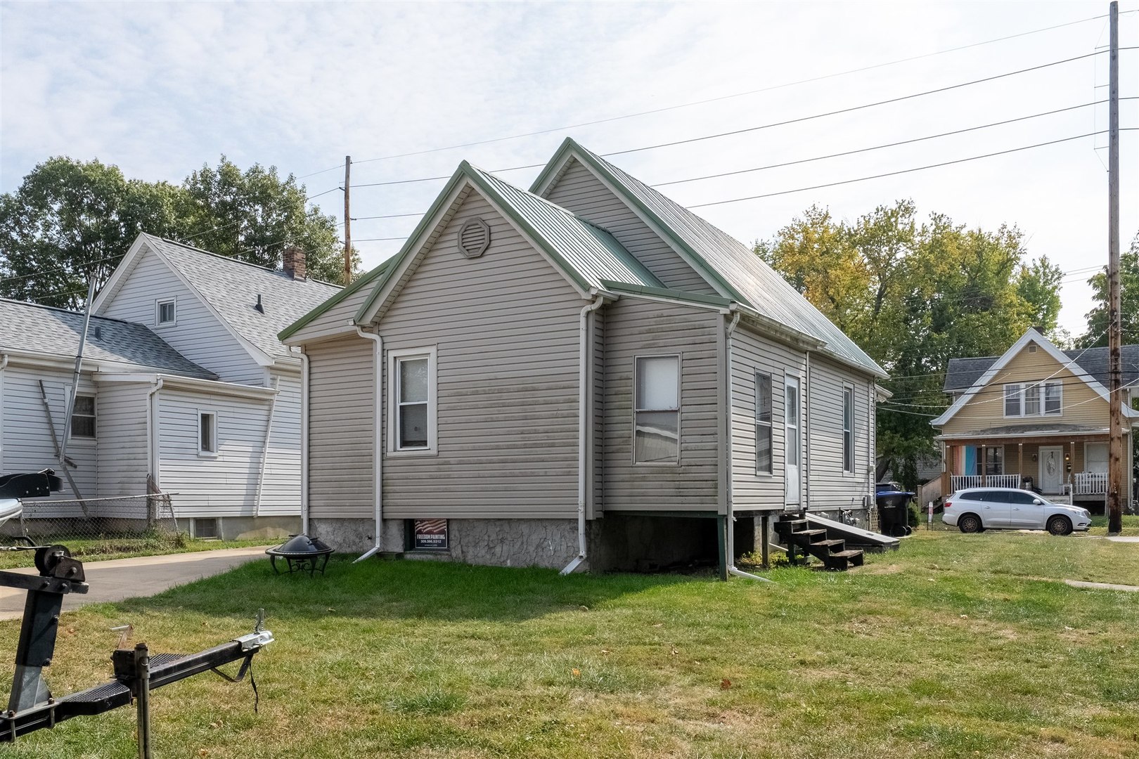 603 West Oakland Avenue Bloomington, IL 61701 - Photo 27 of 33 a view of a house with a yard patio and fire pit