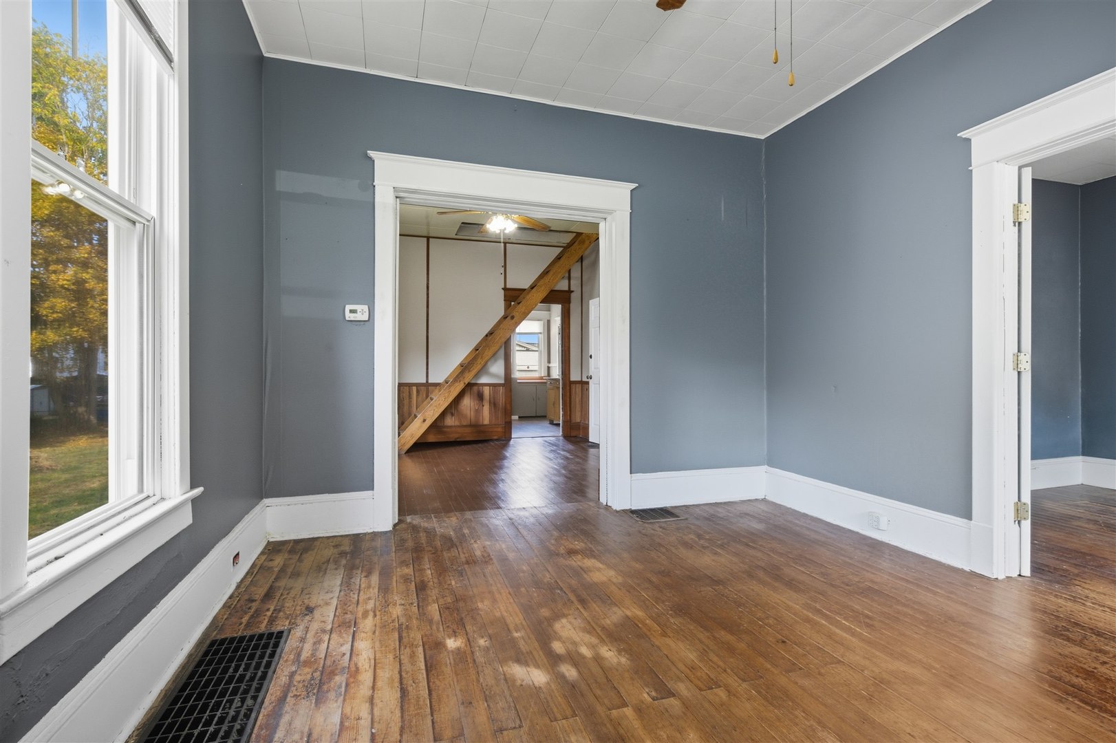 603 West Oakland Avenue Bloomington, IL 61701 - Photo 6 of 33 a view of a hallway with wooden floor and staircase