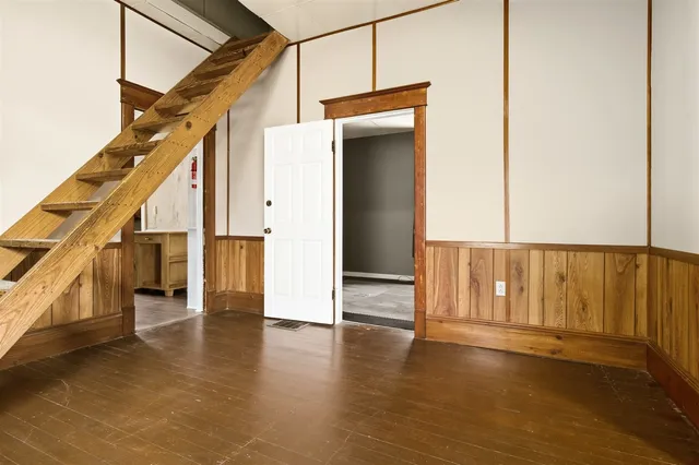 a view of an entryway with wooden floor