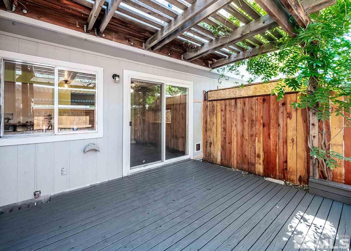 960 Cherry Tree Drive, Unit 2 Sparks, NV 89434 - Photo 18 of 19 a view of an empty room with wooden floor and a window