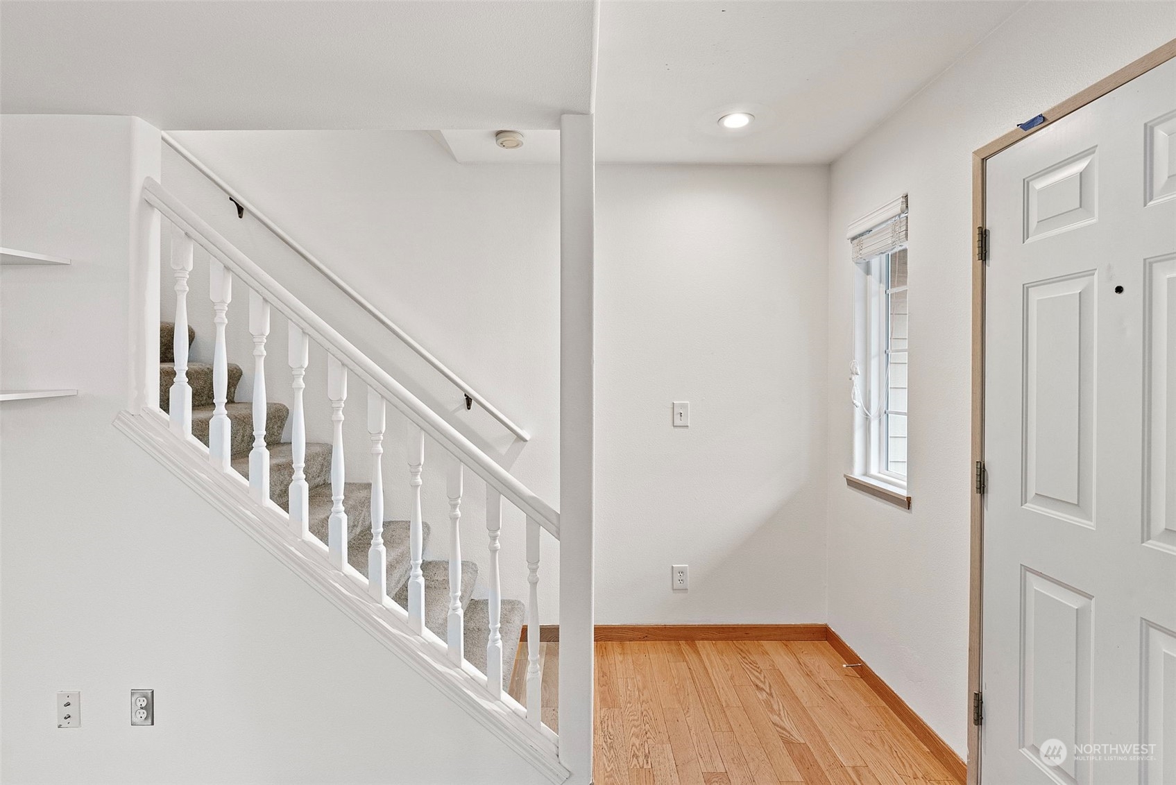 3962 Broadmoor Loop Bremerton, WA 98310 - Photo 8 of 22 a view of a hallway with wooden floor and entryway