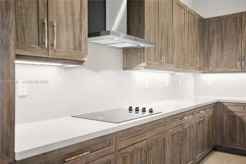 a kitchen with a sink and cabinets