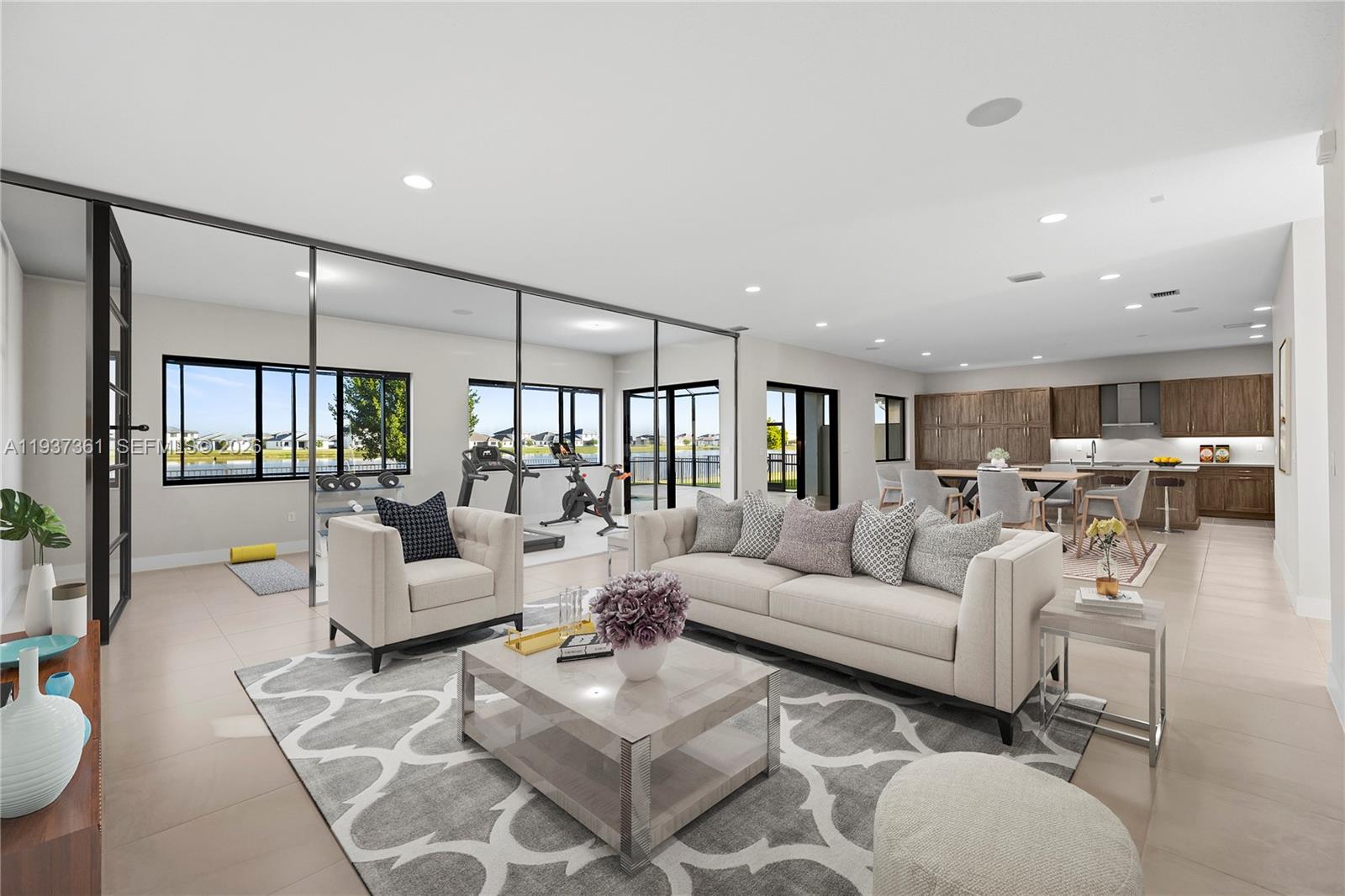 5197 Julienne Road Ave Maria, FL 34142 - Photo 15 of 44 a living room with furniture and a large window