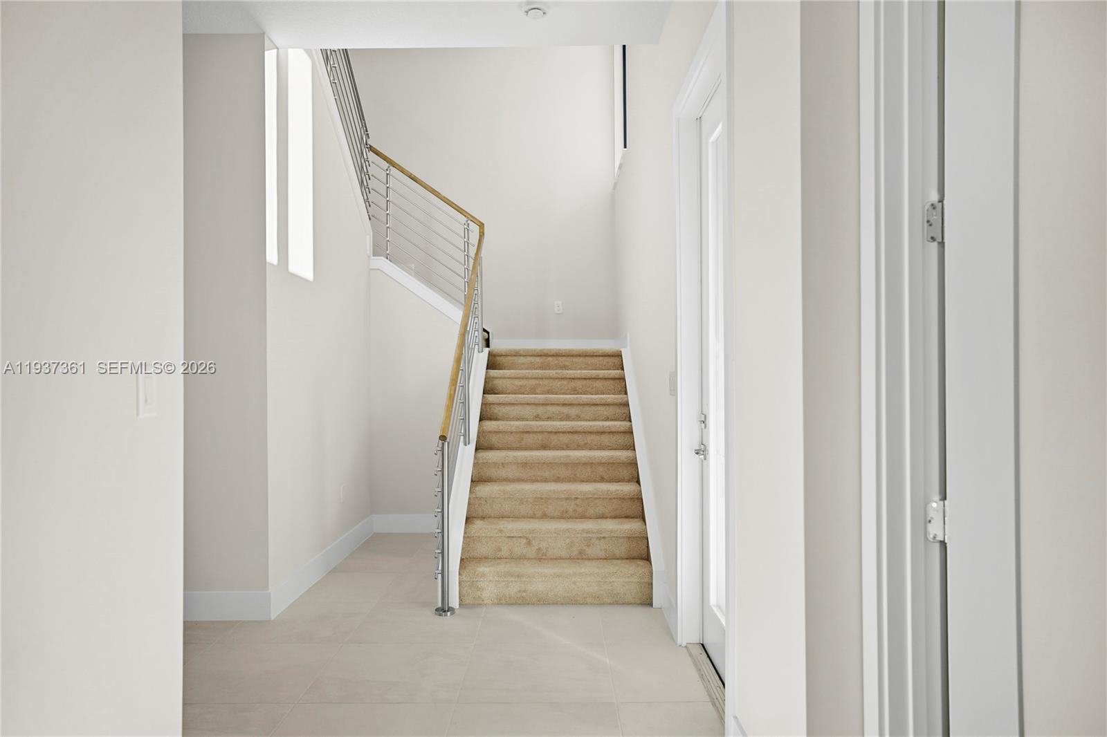 5197 Julienne Road Ave Maria, FL 34142 - Photo 20 of 43 Contemporary cable-railed staircase connecting both levels