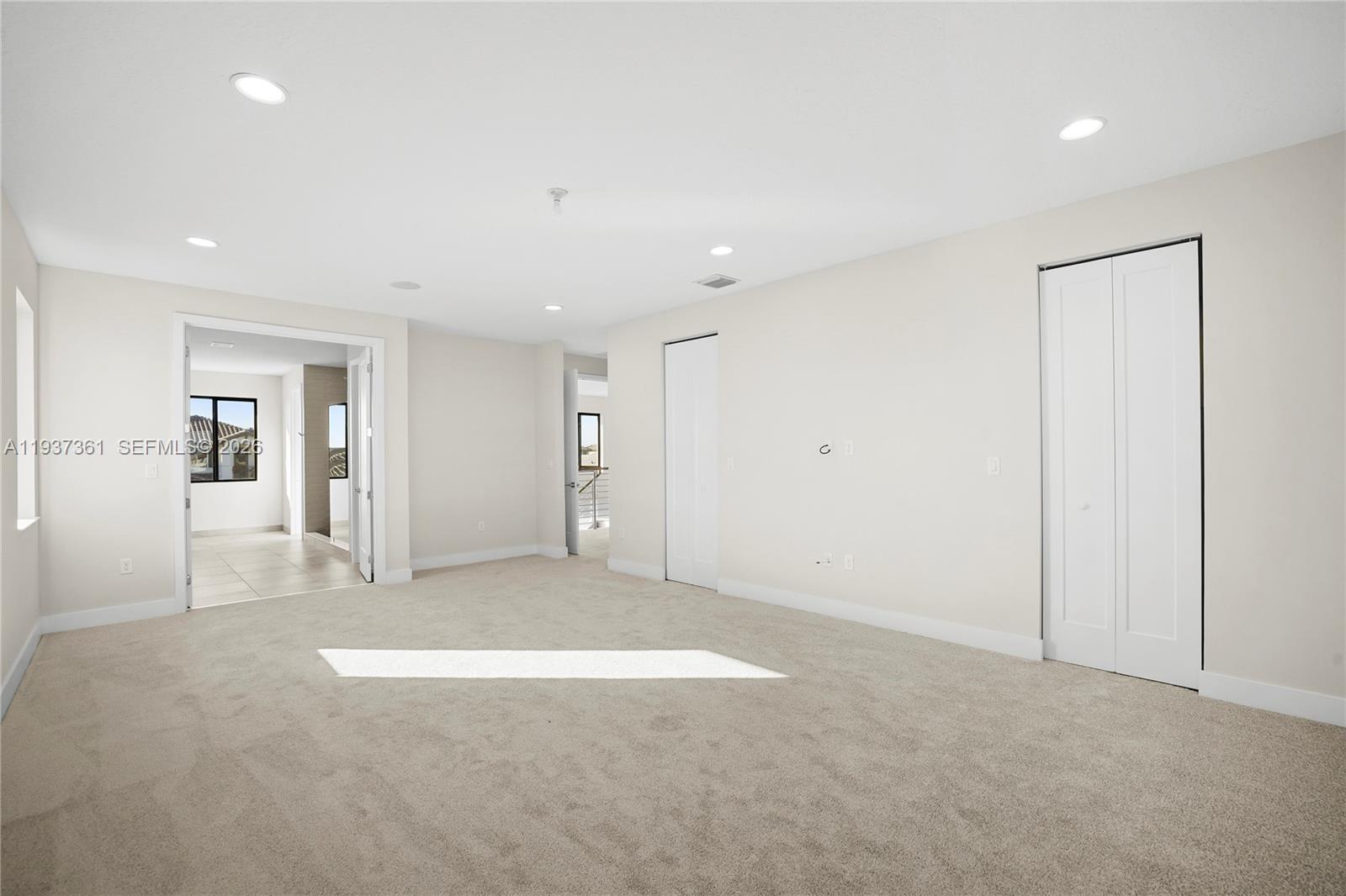 5197 Julienne Road Ave Maria, FL 34142 - Photo 25 of 43 Primary bedroom with generous layout and natural light