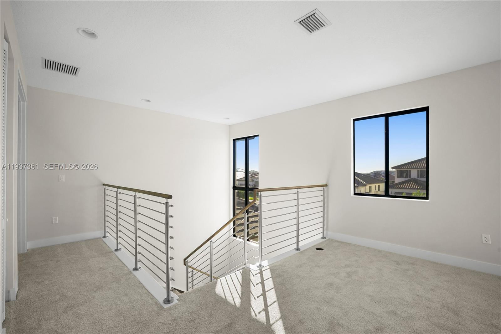 5197 Julienne Road Ave Maria, FL 34142 - Photo 25 of 44 a view of an empty room with stairs