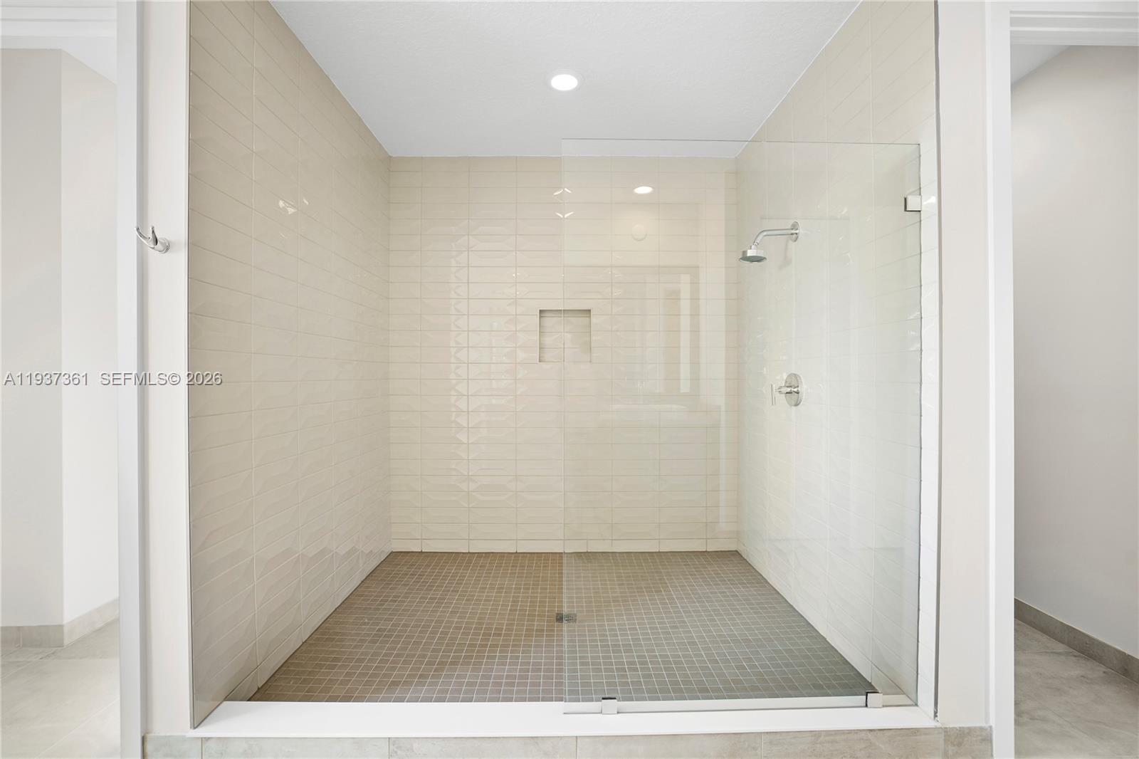 5197 Julienne Road Ave Maria, FL 34142 - Photo 30 of 43 Oversized walk-in shower with floor-to-ceiling tile