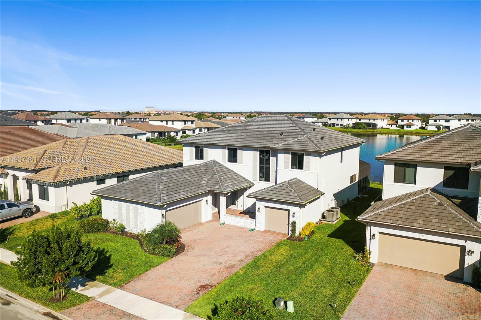 5197 Julienne Road Ave Maria, FL 34142 - Photo 3 of 43 Aerial view of the subject home centered in Maple Ridge with lake behind
