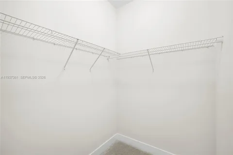 a view of a hallway with closet