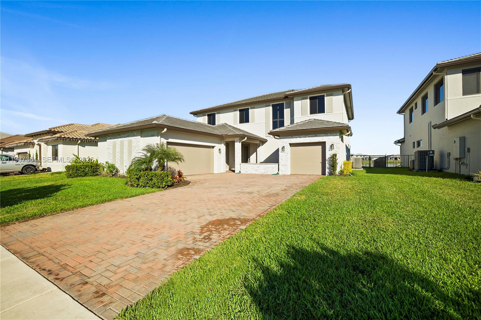 5197 Julienne Road Ave Maria, FL 34142 - Photo 43 of 43 Front exterior view showcasing the home’s modern elevation and paver driveway