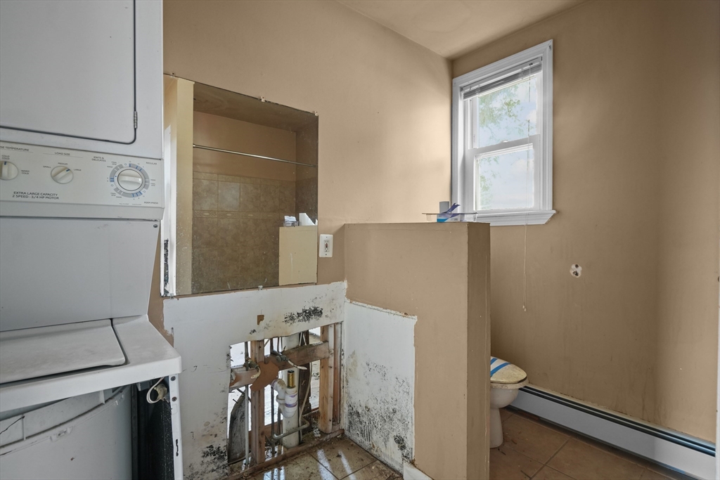 213 Weetamoe Street Fall River, MA 02720 - Photo 21 of 34 a bathroom with a sink and a mirror