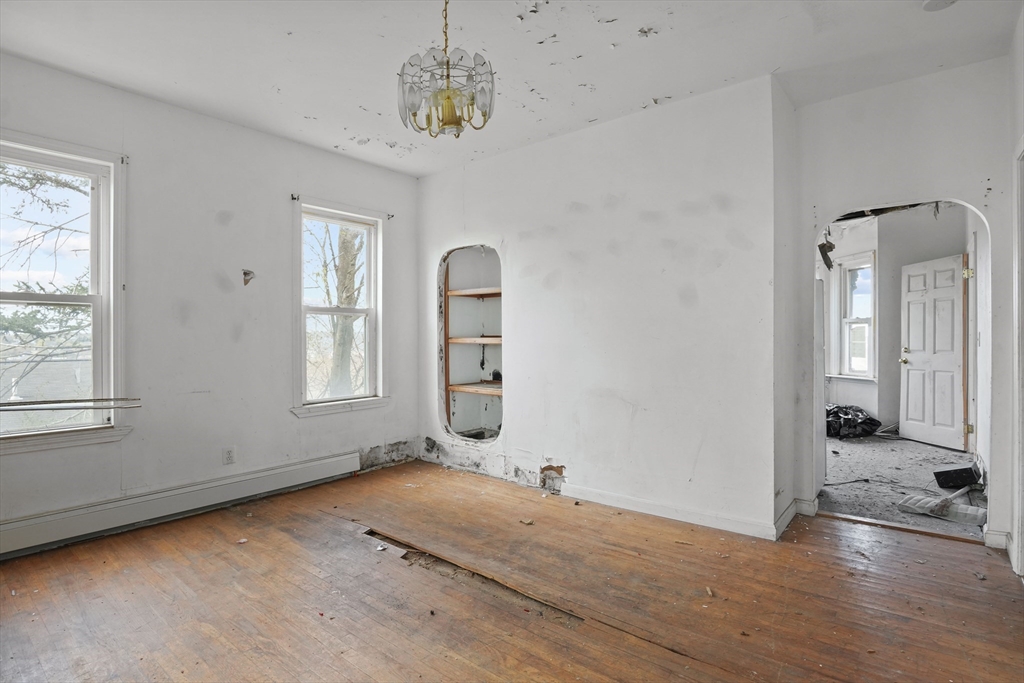 213 Weetamoe Street Fall River, MA 02720 - Photo 22 of 34 wooden floor in an empty room with a window