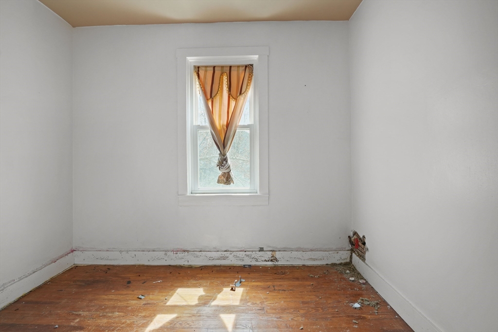 213 Weetamoe Street Fall River, MA 02720 - Photo 31 of 34 an empty room with a window