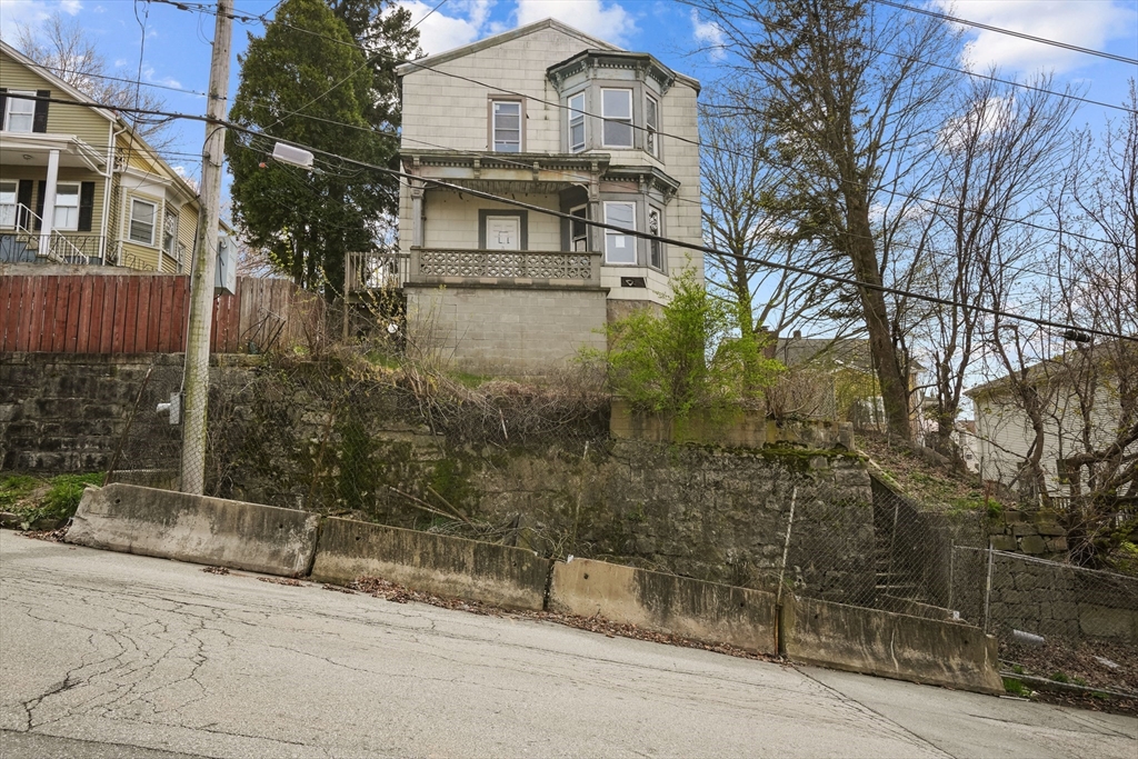 213 Weetamoe Street Fall River, MA 02720 - Photo 34 of 34 a view of a building with a yard