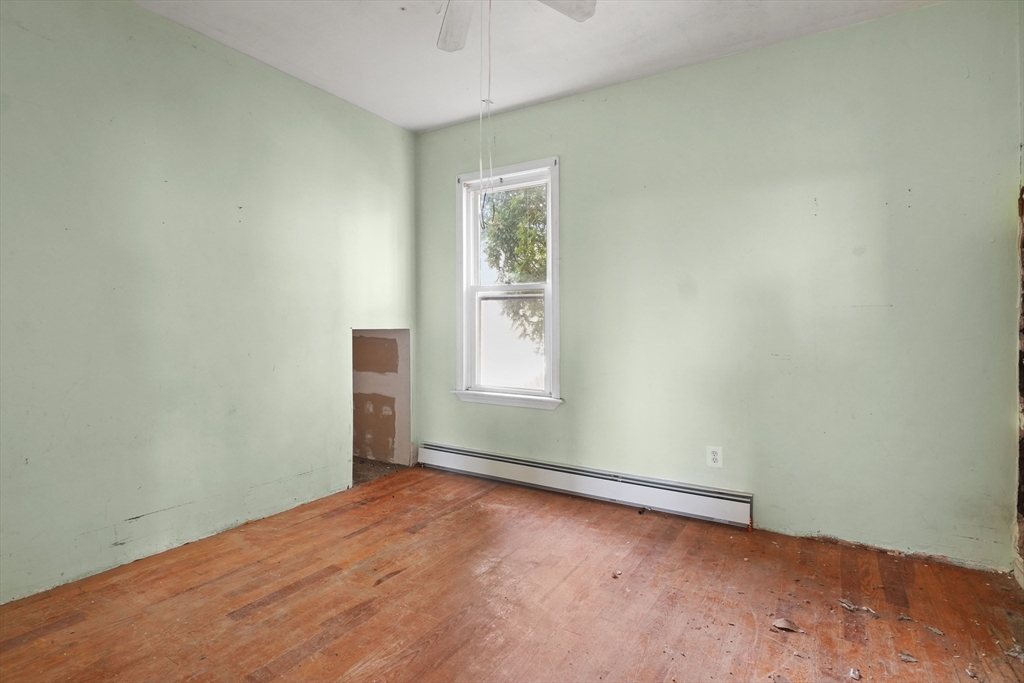 213 Weetamoe Street Fall River, MA 02720 - Photo 4 of 34 an empty room with windows