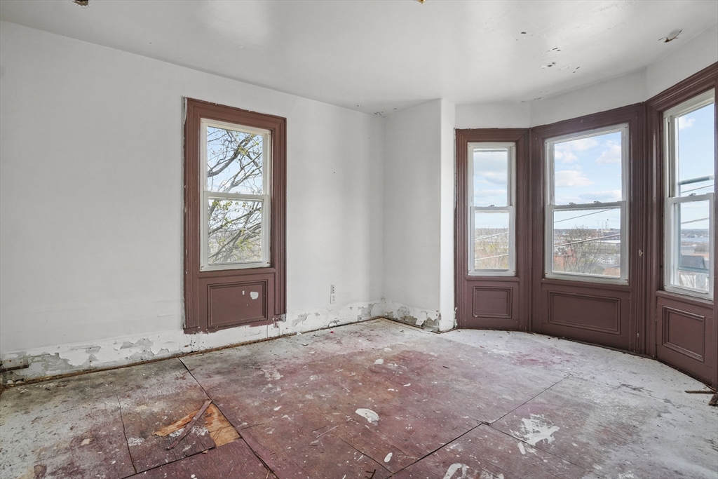 213 Weetamoe Street Fall River, MA 02720 - Photo 5 of 34 a view of an empty room with a window