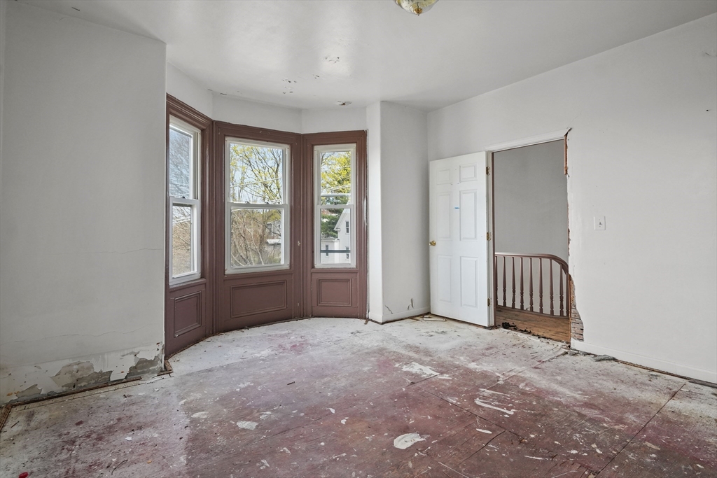 213 Weetamoe Street Fall River, MA 02720 - Photo 6 of 34 a view of an empty room with a window
