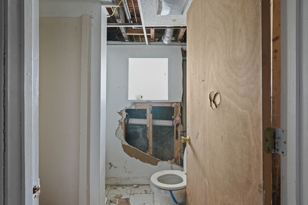 213 Weetamoe Street Fall River, MA 02720 - Photo 10 of 34 a bathroom with a sink and mirror