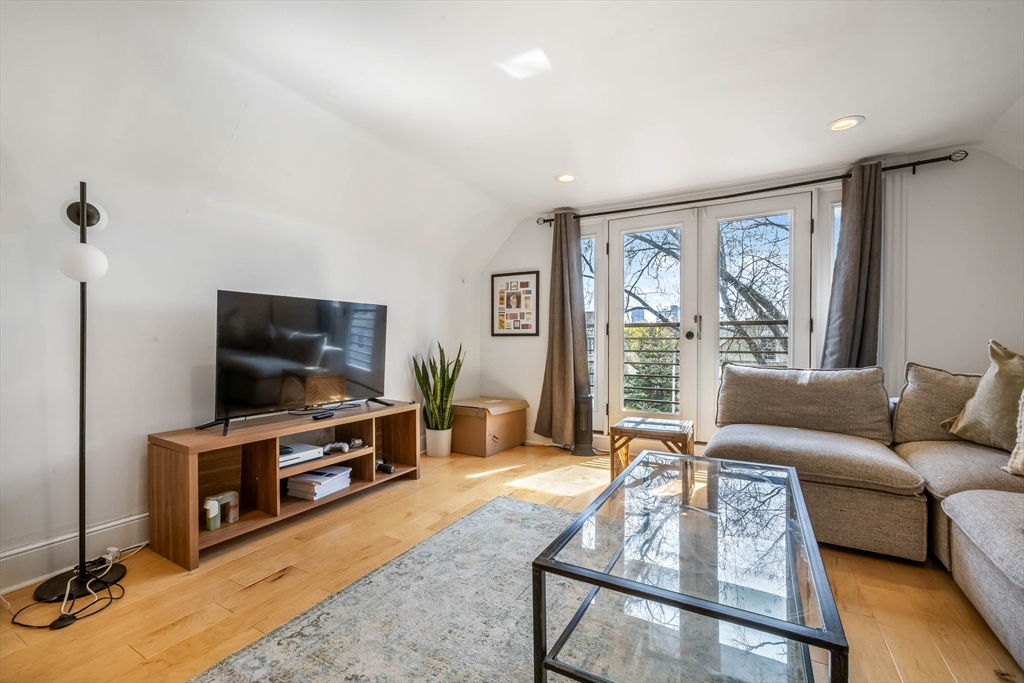 151 Magazine Street, Unit 3 Cambridge, MA 02139 - Photo 16 of 26 a living room with furniture and a flat screen tv