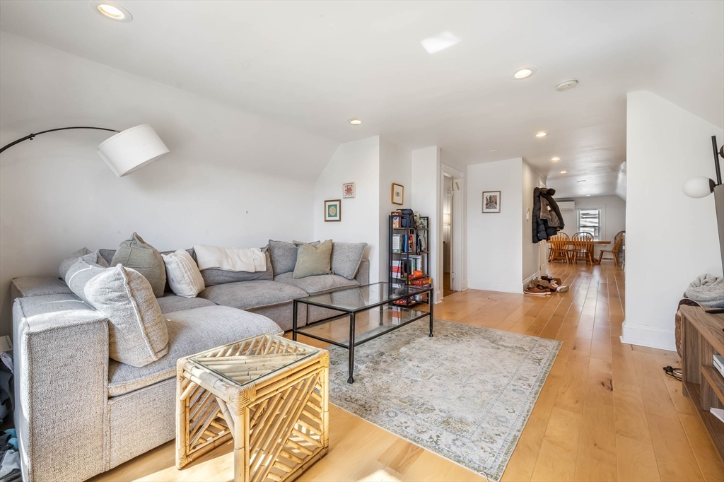 151 Magazine Street, Unit 3 Cambridge, MA 02139 - Photo 17 of 26 a living room with furniture and a wooden floor