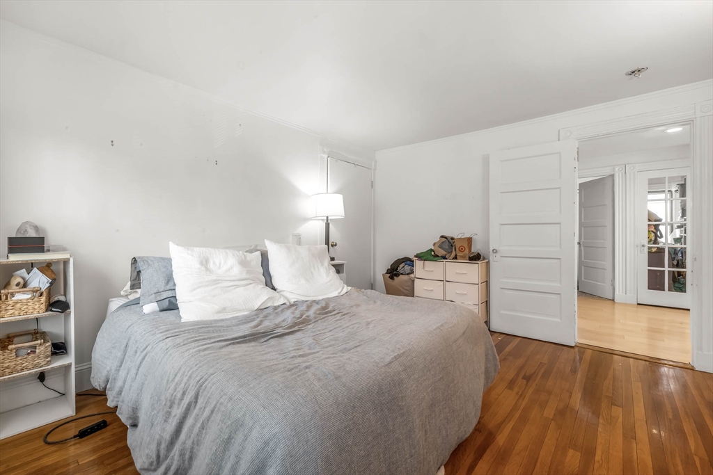 151 Magazine Street, Unit 3 Cambridge, MA 02139 - Photo 20 of 26 a room with a bed and a view of bedroom