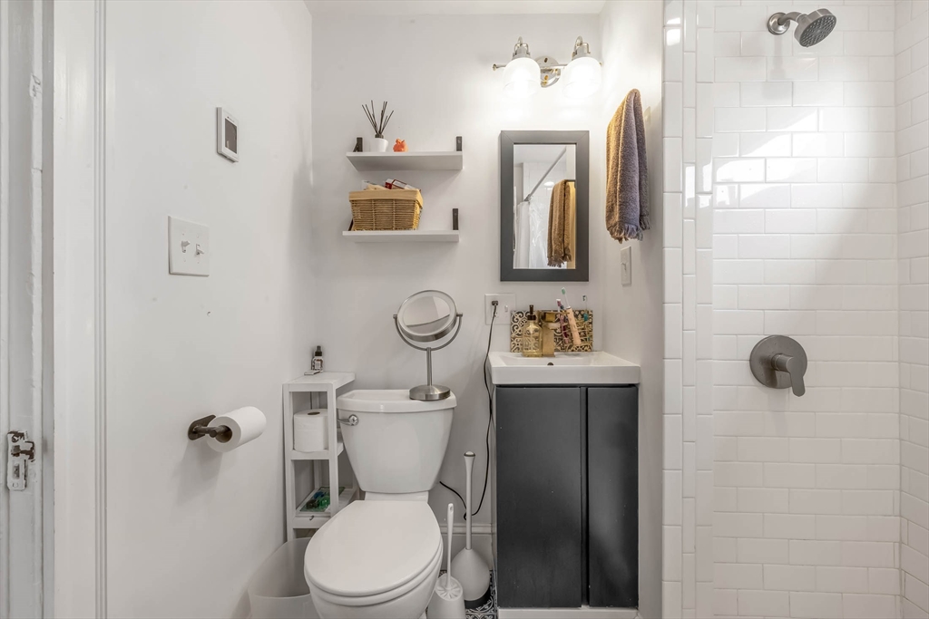 151 Magazine Street, Unit 3 Cambridge, MA 02139 - Photo 23 of 26 a bathroom with a toilet sink shower and mirror