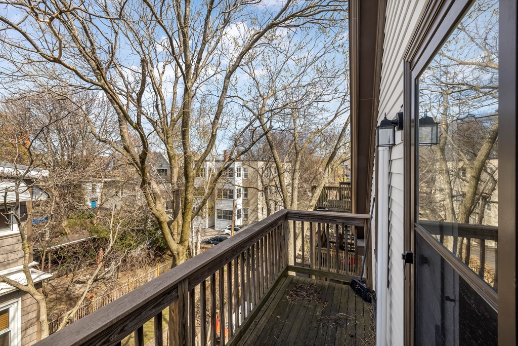 151 Magazine Street, Unit 3 Cambridge, MA 02139 - Photo 25 of 26 a view of a balcony with wooden fence and floor