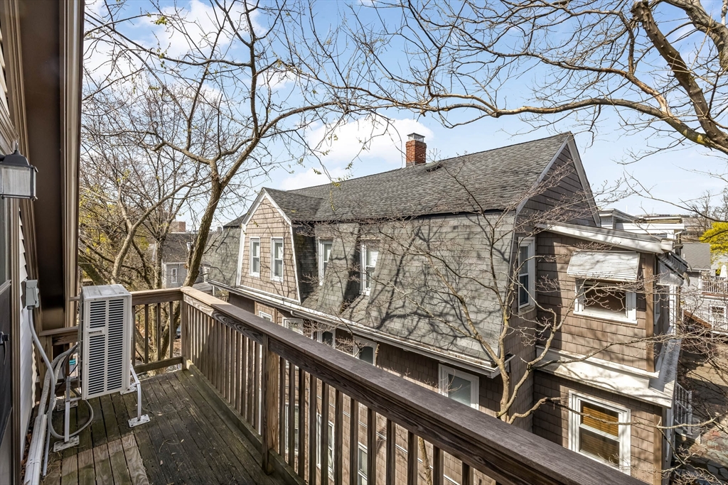 151 Magazine Street, Unit 3 Cambridge, MA 02139 - Photo 26 of 26 a view of a building with a tree