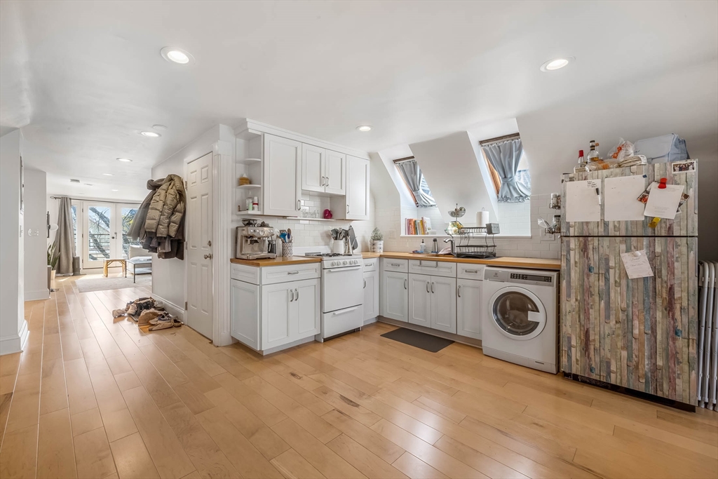 151 Magazine Street, Unit 3 Cambridge, MA 02139 - Photo 7 of 26 a kitchen with cabinets a sink and appliances