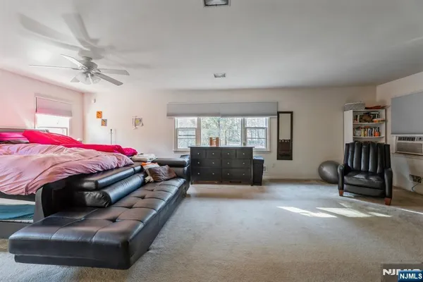 a bed room with a bed and a chair