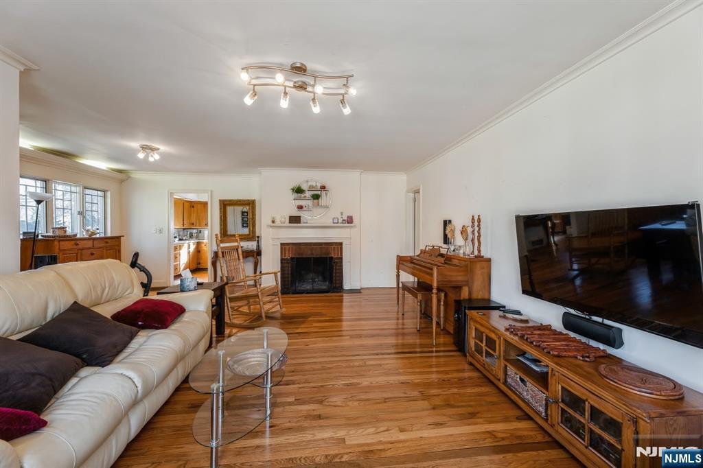 58 Taillon Terrace Closter, NJ 07624 - Photo 4 of 24 a living room with furniture and a flat screen tv